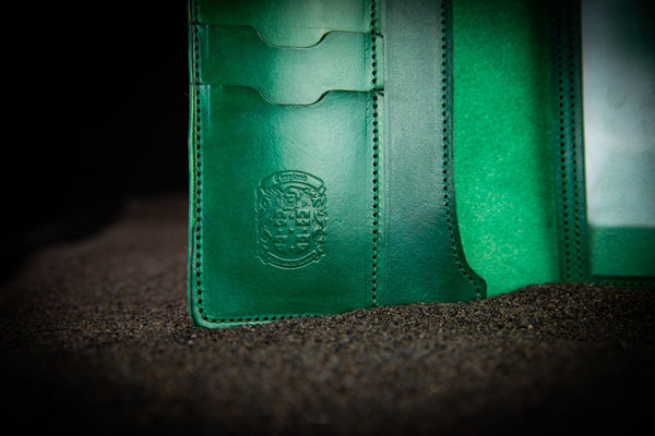green leather firearms certificate and card holder close up of coupland crest