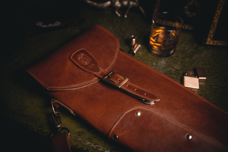 brown leather shotgun slip closed and coupland leather whisky tumbler