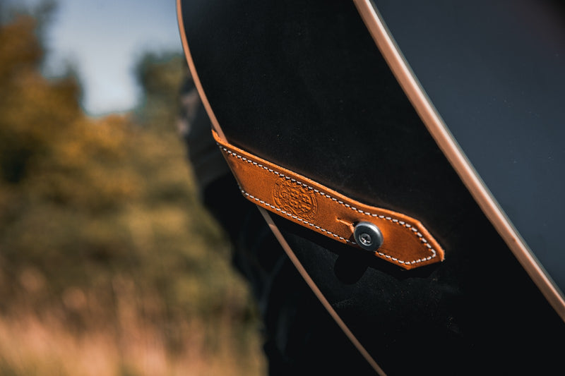 Leather acoustic guitar strap button hole