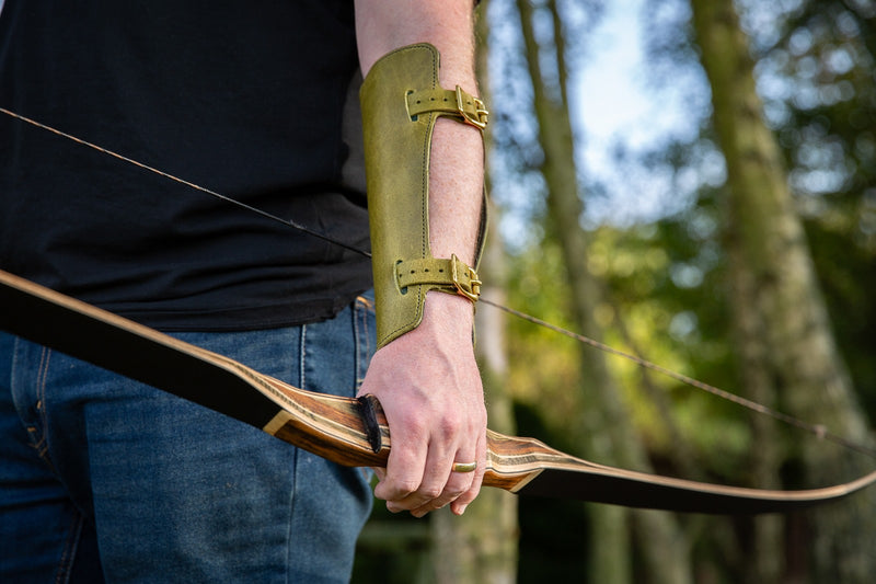 Adjustable leather archery arm guard