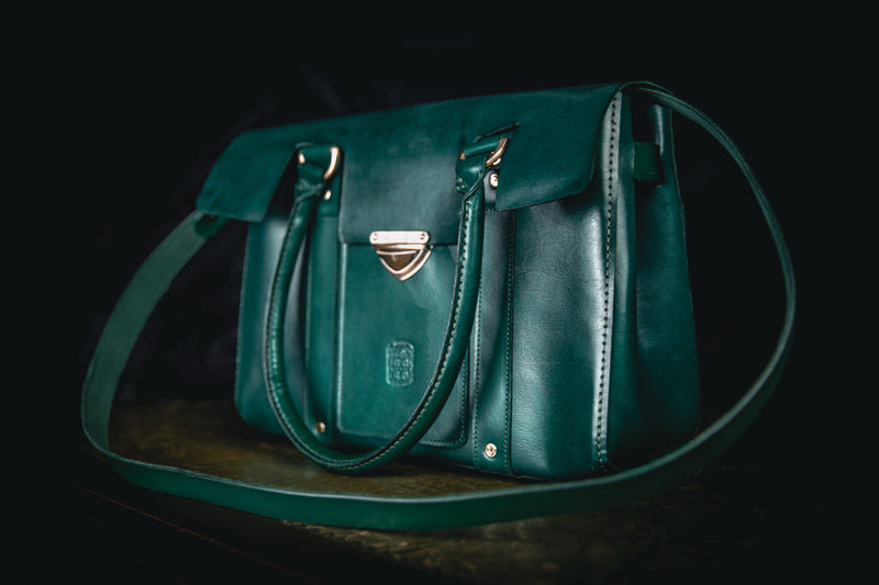 green ladies leather handbag with shoulder strap