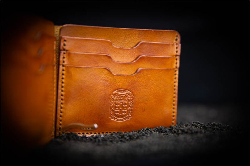 coupland crest close up on Benjamin leather wallet