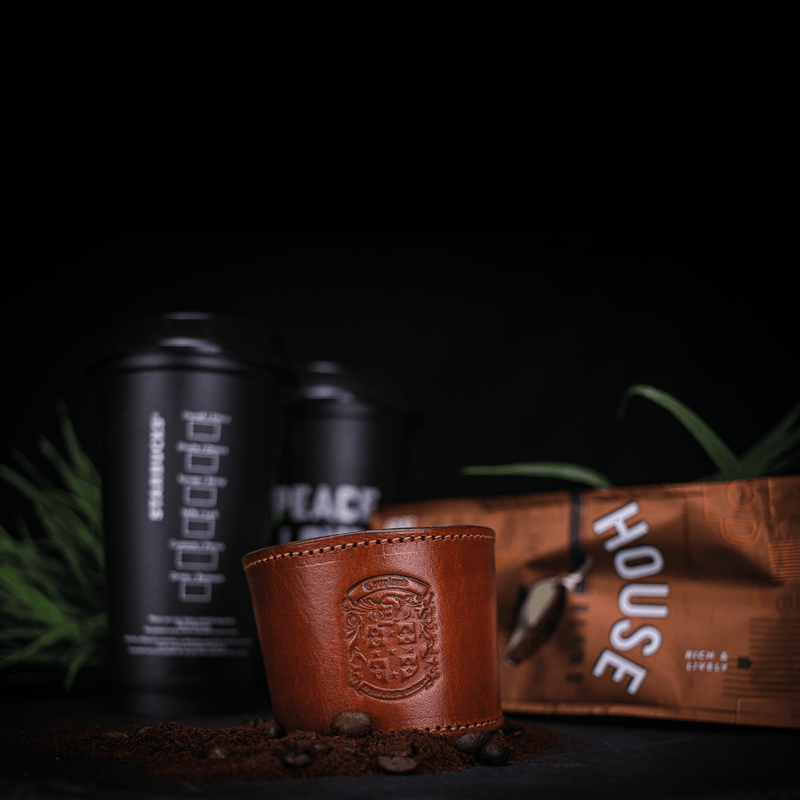 bespoke leather coffee cup sleeve with coupland crest with coffee and coffee cups
