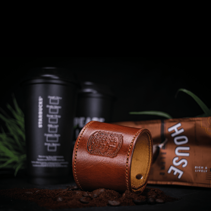 bespoke leather coffee cup sleeve with coupland crest with coffee and coffee cups