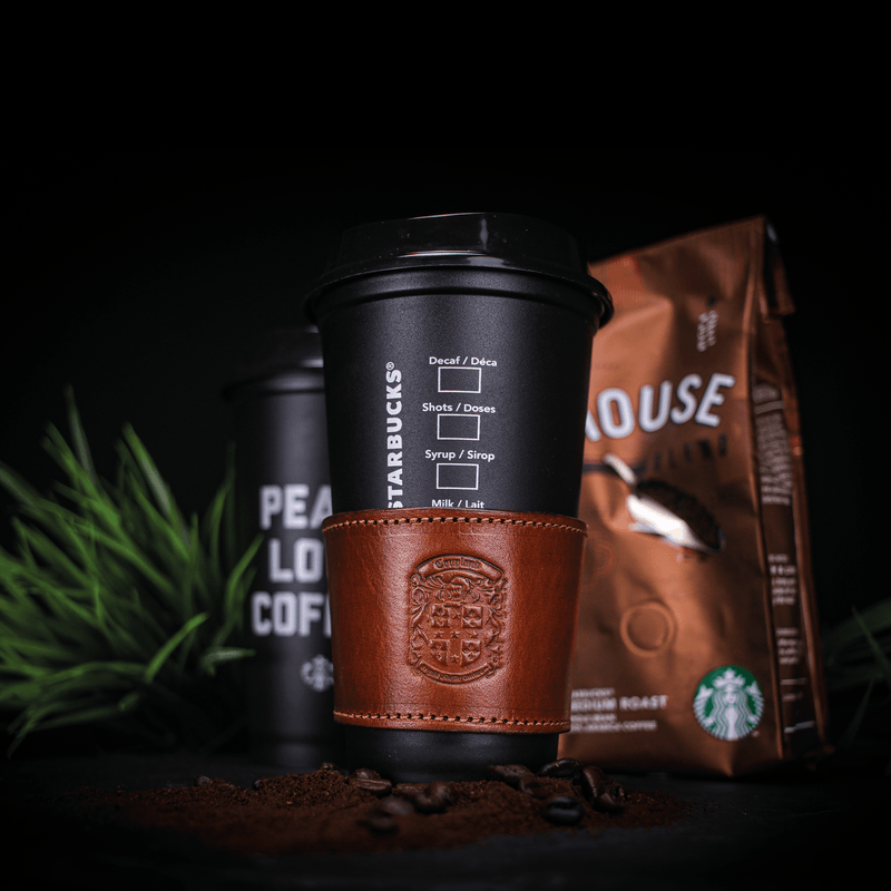 bespoke leather coffee cup sleeve on coffee cup
