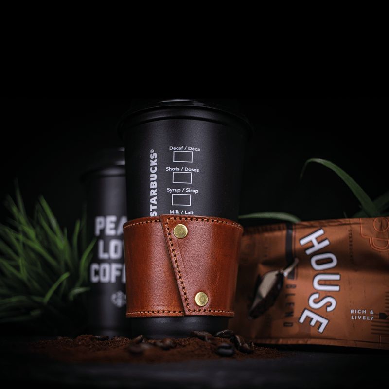 bespoke leather coffee cup sleeve on coffee cup