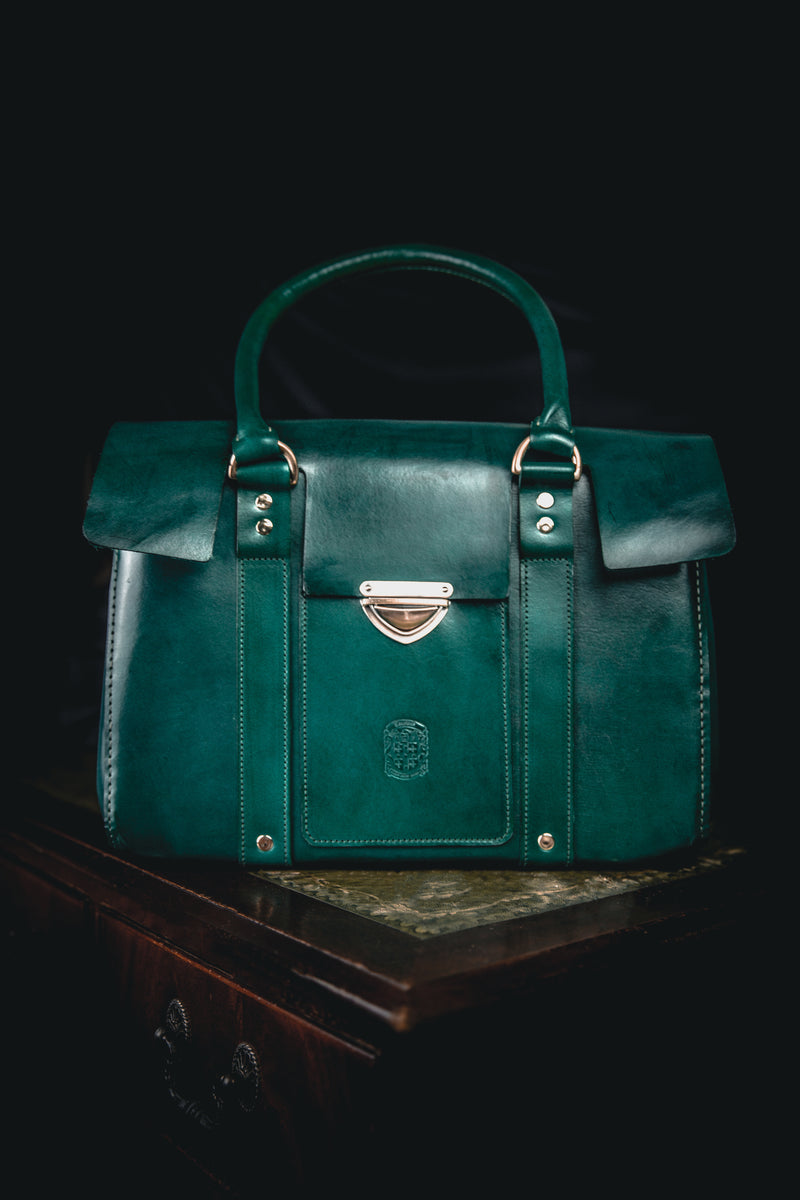 green ladies leather handbag with coupland crest