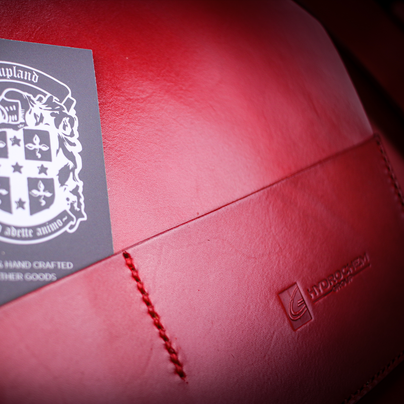 A4 red leather book cover close up of company branding