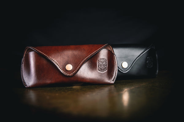 dark brown leather sunglasses case with coupland crest