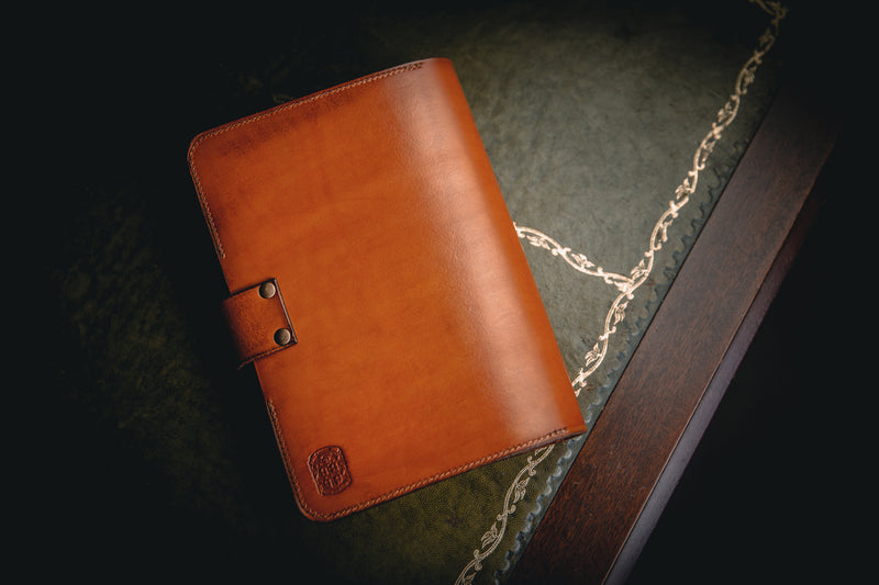 A5 tan leather book cover closed with coupland crest