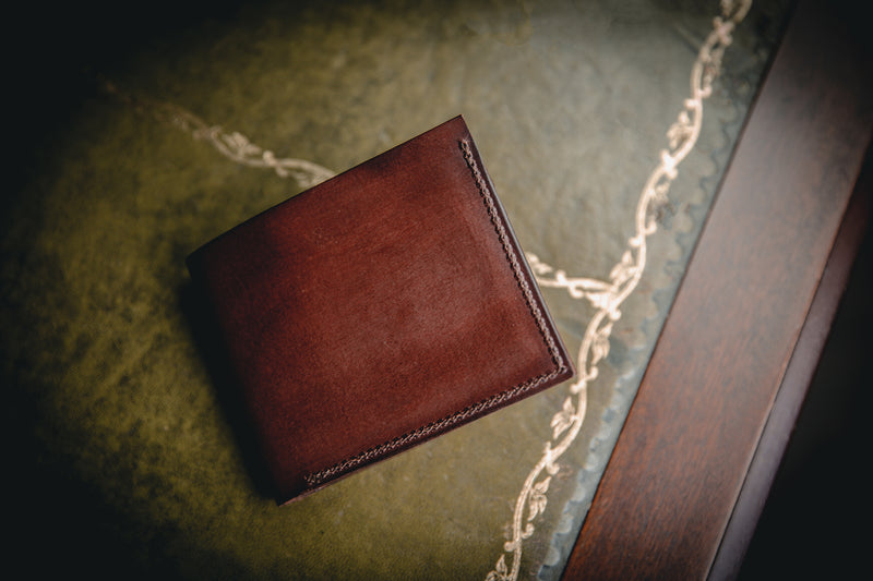the AJ leather wallet in dark brown, closed