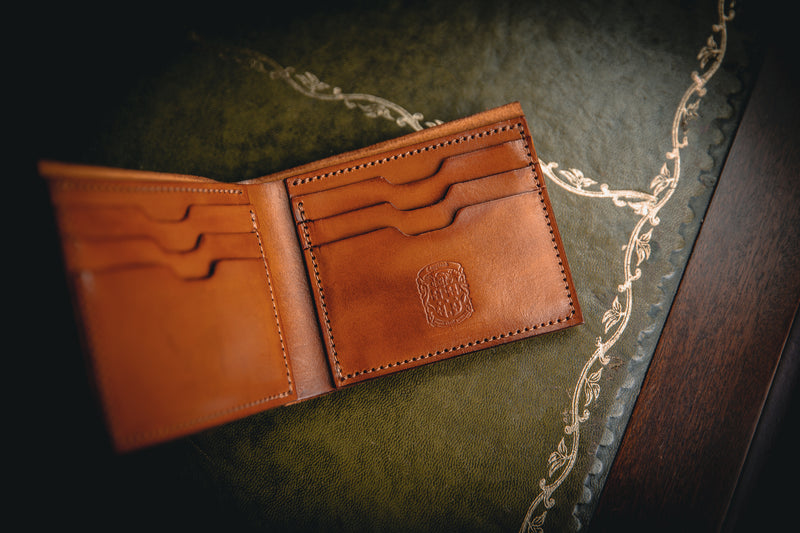 the AJ leather wallet open with coupland crest