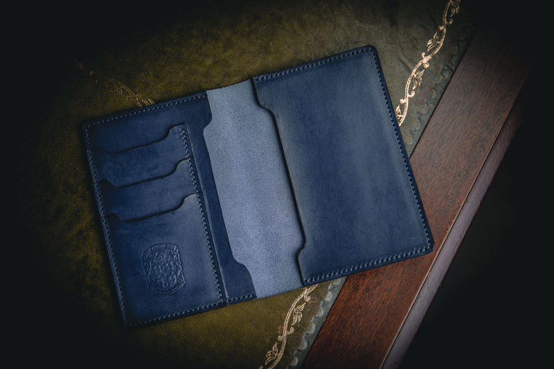 blue leather passport wallet with card holders and coupland crest
