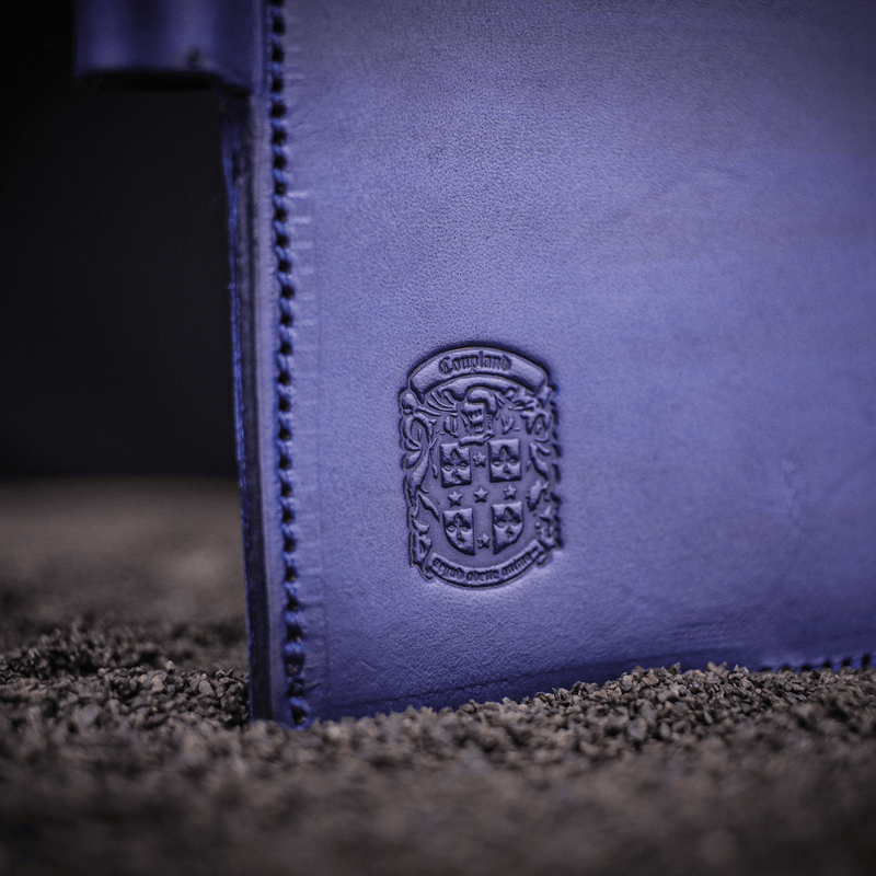 blue leather golf scorecard holder with coupland crest close up