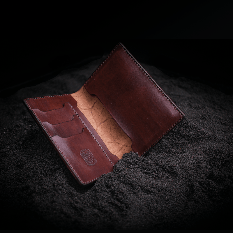 open brown leather passport holder with coupland crest