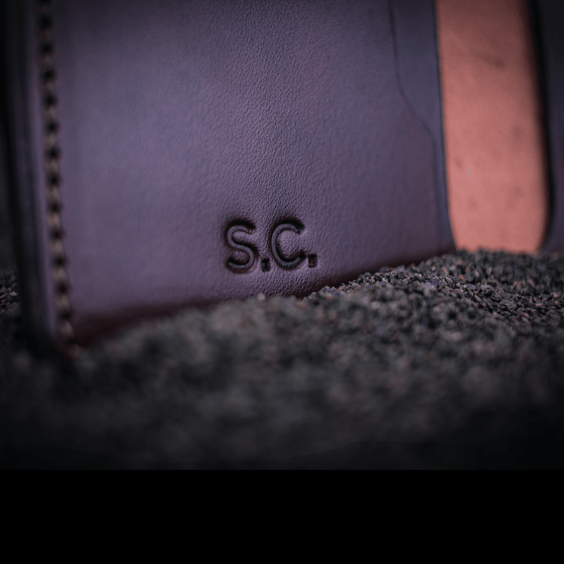 close up of engraved initials on the Rob leather wallet