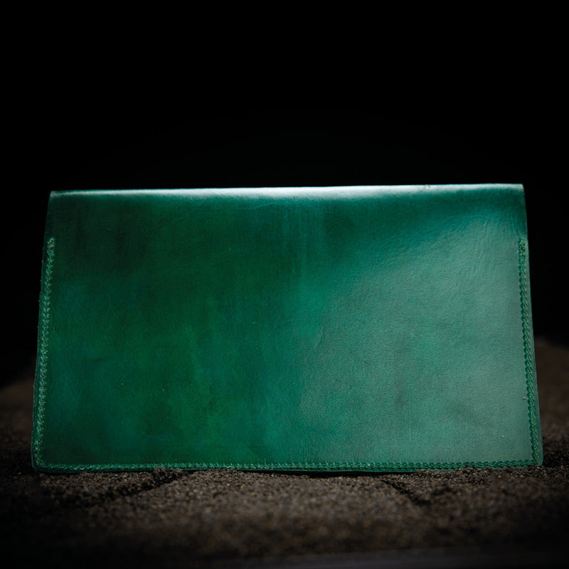 green leather firearms certificate and card holder closed