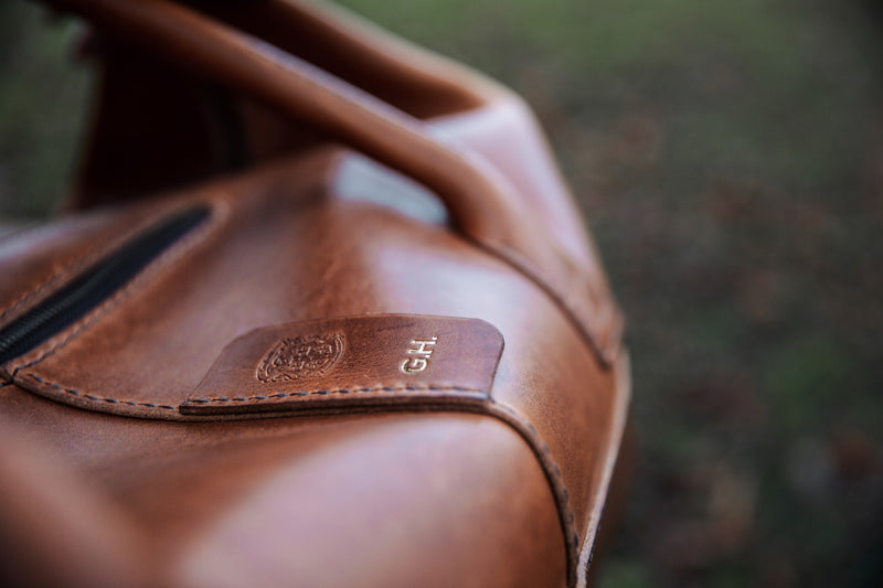 close up of personalisation on leather duffle bag