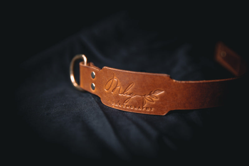 brown leather branded camera wrist strap