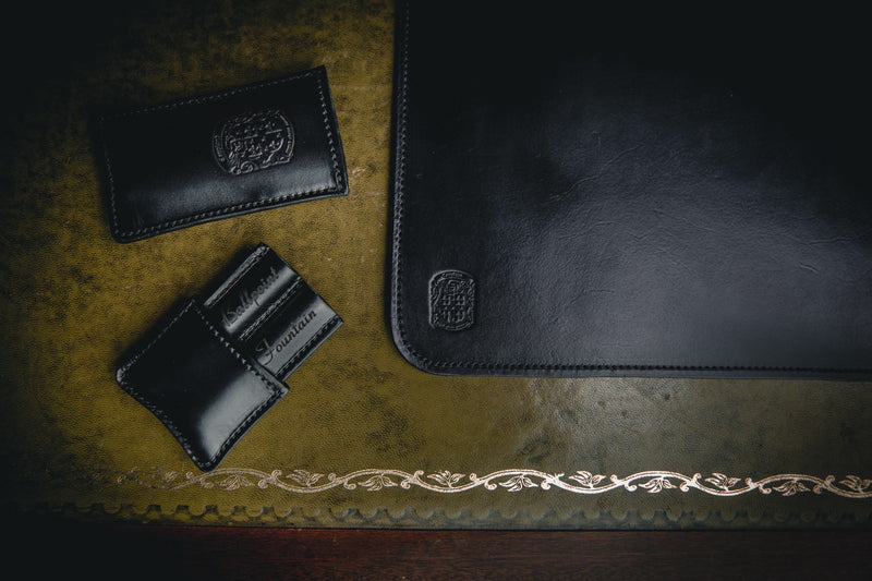 black leather desk mat with double branded pen holder and coupland crests