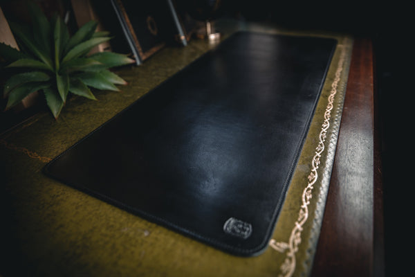 black leather desk mat on desk