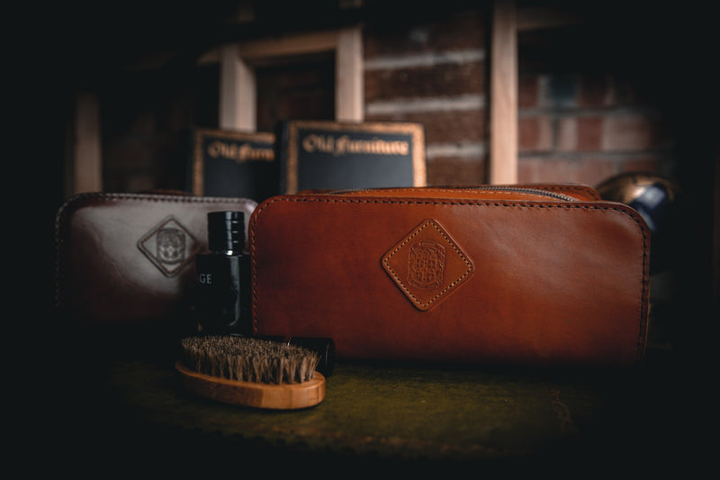 two large leather holmes toiletry bags  
